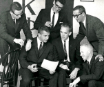 Former archon George Cameron holding the original Beta Omicron chapter gavel in 1963.